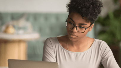 A person looking at a laptop