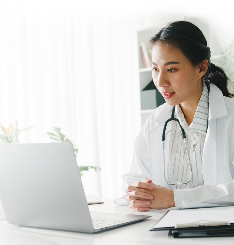 Doctor looking at a computer screen